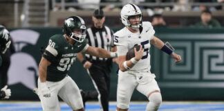 
			
				                                Penn State quarterback Drew Allar is chased by Michigan State defensive lineman Avery Dunn during the second half of an NCAA football game Friday in Detroit.
                                 AP photo

			
		