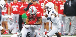 
			
				                                Ohio State receiver Julian Fleming, center, catches a pass against Penn State in October. A record-smashing wideout at Southern Columbia, Fleming is transferring to play his final college season for the Nittany Lions.
                                 Jay LaPrete | AP file photo

			
		