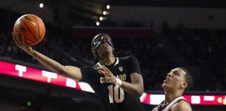 
			
				                                Colorado forward Cody Williams (10) shoots next to Southern California guard Kobe Johnson (0) during the second half of an NCAA basketball game last month in Los Angeles. Colorado won, 92-89 in double overtime.
                                 AP photo

			
		