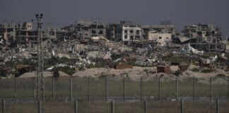 
			
				                                Destroyed buildings stand in the Gaza Strip as seen from southern Israel no Thursday.
                                 AP Photo

			
		