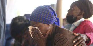
			
				                                Family members of the bus crash victims gather at the ZCC Church in the Molepolole village near Gaborone, Botswana, on Friday. A bus carrying Easter pilgrims from Botswana to Moria in South Africa crashed en route in Mokopane, South Africa, claiming the lives of some 45 people. An 8-year-old survived.
                                 AP Photo

			
		