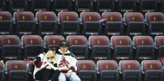 
			
				                                Arizona Coyotes fans sit in their seats long after the team’s final game ended on Wednesday night. Less than a day later, the Coyotes were sold to the owners of the Utah Jazz, who will move the team to Salt Lake City for next season.
                                 Ross D. Franklin | AP photo

			
		